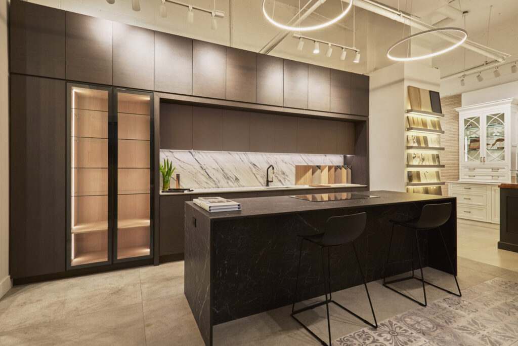 Cabinets : Miralis Door Style : Scott, Mitered Door Door Color : Abaca Green Collection : Wood Countertop : Dekton Color name : Trance Faucet : Brizo Litze Touchless Faucet Sink : Moen Lighting : Hafele Island Countertop : Dekton Color name : Somnia