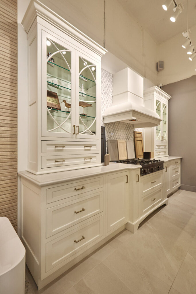 Cabinets : Plain and Fancy Cabinet Style : Inset Cabinet Door Style : Vogue Door Color : Celeste White Handles : Top Knobs, Kara Pulls Countertop : Caesarstone, Quartz Color name : London Grey Stove : Wolf Flooring : Tilebar Color : Fordham White 24x24