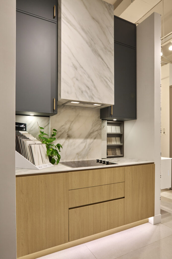 Cabinets : Miralis Upper Cabinet Door Style : Tribeca, Micro Shaker Door Color : Abaca Green Collection : Advanced Engineered, Fenix Handles : Top Knobs, Bar Pulls Bottom Cabinet Door Style : Scoot , Mitered Edge Door Door Color : Natura Collection : Laminate Countertop : Caesarstone, Porcelain Color name : 505 Archetta